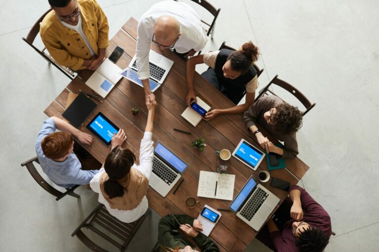A team reviewing performance metrics around a table