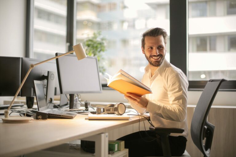 Man checking files at a desk