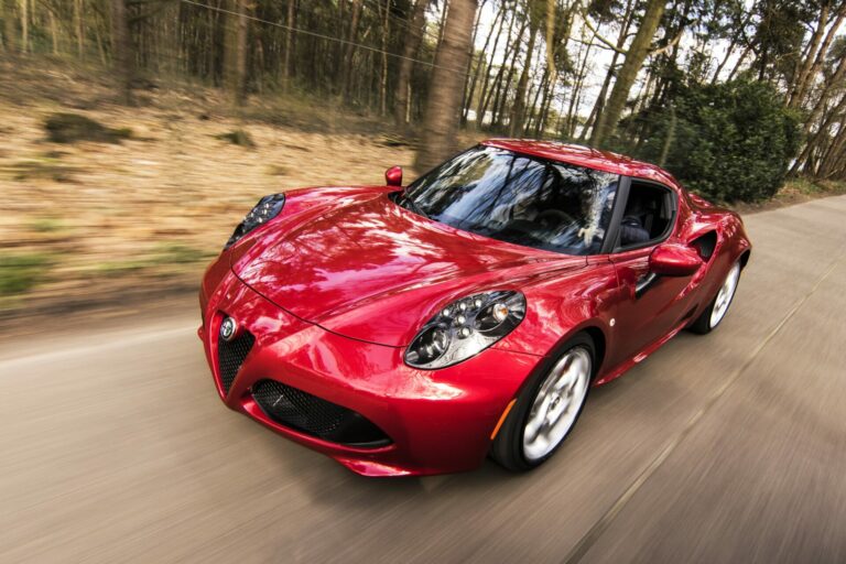 A modern, red car driving fast